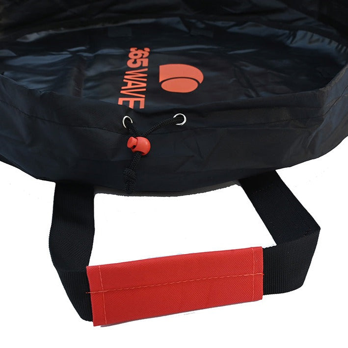A detail view of the handle and cinch of the Changing Mat/Dry Bag